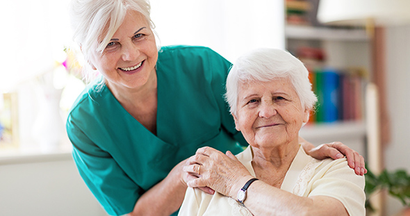 Temporary to permanent healthcare staffing solutions. Carer and elderly woman.