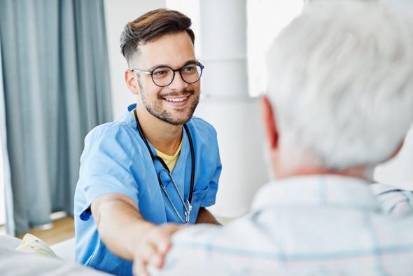 Healthcare recruitment in Wolverhampton. Care vacancies in West Midlands. Young man helping old man.